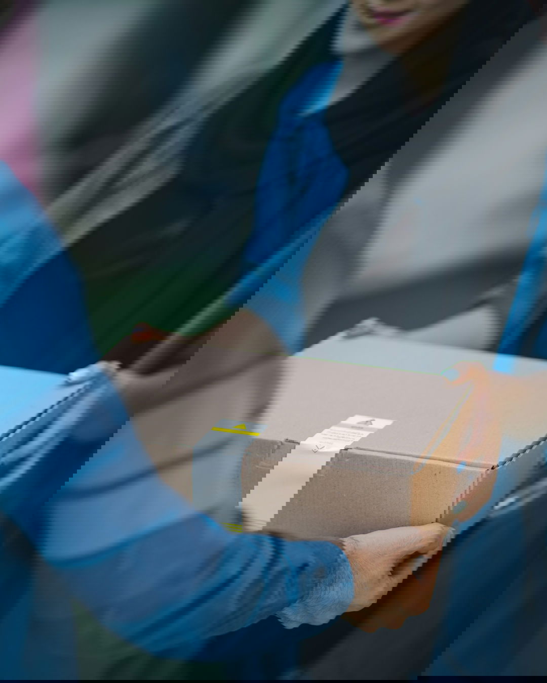 person giving brown box