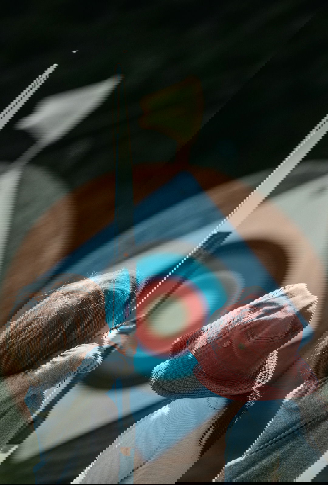 two child playing arrow